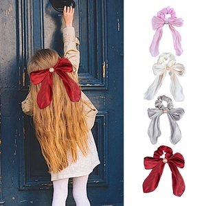 Elegant satin bow hair scrunchies with pearls in red, beige, grey, and pink colors
