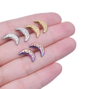 Detail of 304 stainless steel crescent moon earrings with hammered texture finish
