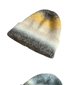 Close-up of thick gradient tie-dye knit beanie showing detailed texture and warm fabric