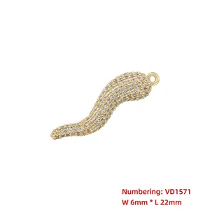 Detail of 6x22mm gold cornicello pendant with white cubic zirconia pavé stones