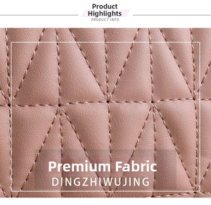 Detailed macro view of pink quilted leather texture with classic diamond lattice stitching