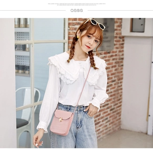 Chic pink crocodile pattern crossbody bag with golden twist lock on casual outfit