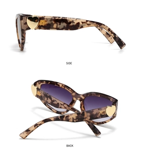 Detail view of tortoiseshell butterfly sunglasses with golden heart temple accents
