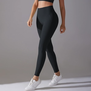 Close-up of high-waisted black yoga pants showing tummy control and seamless design
