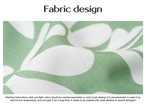 Detailed fabric texture with green leaf print and clear English washing instructions