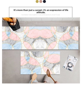 Detail view of marble pattern rugs in pink and blue with elegant gold borders
