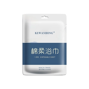 Thick disposable travel bath towel made of soft cotton in a portable single package