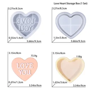 Vista dettagliata degli stampi in silicone a cuore e scatole in resina epossidica con scritta Love You