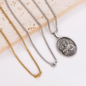 Religious stainless steel oval pendant necklace with Saint Joseph and Child relief carving
