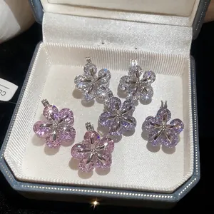 Elegant zircon flower earrings in pink, purple and white displayed in a premium jewelry box