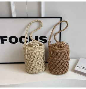 Detailed macro view of handmade crochet bucket bags with 3D texture and drawstring lining