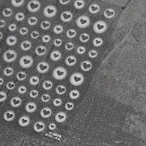 Detail of thin flexible 2D heart shape hollow-out nail stickers for stencil art design