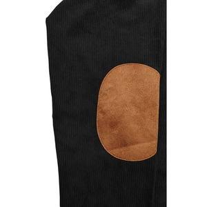 Detail shot of black knitted polo shirt with brown faux suede elbow patches
