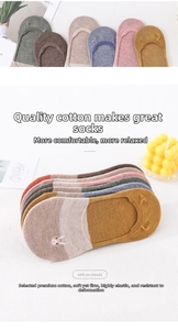 Detail of colorful cotton no-show socks with cute rabbit embroidery and elastic cuffs