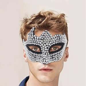 Close-up of a luxury silver rhinestone masquerade mask worn by a male model for parties