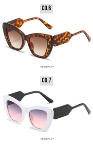 Detailed 45-degree view of oversized cat-eye sunglasses in tortoiseshell and contrast colors