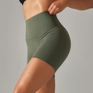 Close-up of olive green high-waisted yoga shorts with seamless high-elastic fabric