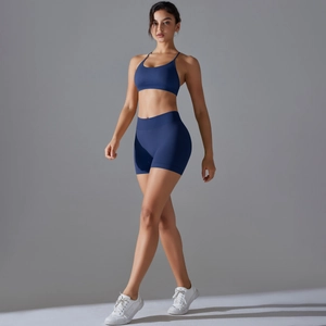 Detail of blue high-waist seamless shorts and elastic racerback sports bra set