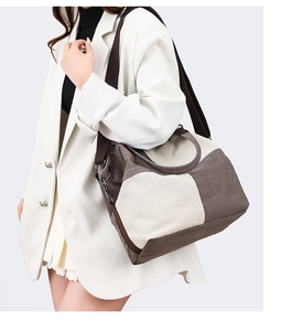 Model wearing a vintage canvas tote bag in brown and cream contrast for daily commute