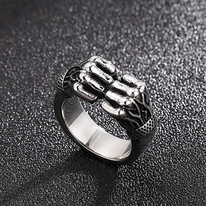 Macro detail of vintage punk double fist rings in antique silver finish steel