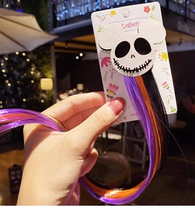 Detail of Halloween hair clip featuring Jack Skellington skull with purple and orange hair