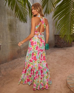 Detailed back view of a floral maxi dress featuring a cross halter neck and waist bow tie