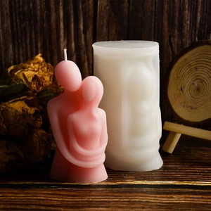 Detailed view of couple hug candle silicone mold with pink finished handmade candle