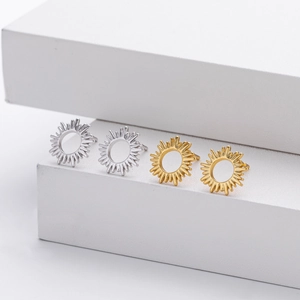 Detailed view of gold and silver sunburst stud earrings in S925 sterling silver