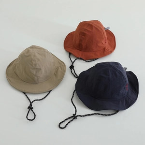 Detail of quick-dry sun hats with adjustable ropes in khaki, navy and brick red