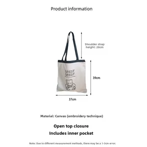Detailed size chart of a white canvas tote bag with lucky bear embroidery and dimensions