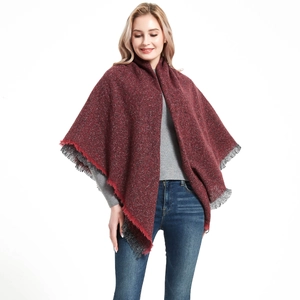 Thick burgundy knitted shawl with black tassel fringe for winter shown on model