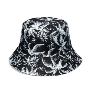 Summer bucket hat with tropical palm leaf print in black and white pattern