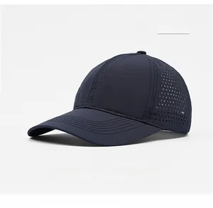Detail view of navy blue baseball cap featuring laser-cut breathable mesh ventilation holes