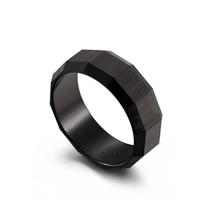 Men's black faceted titanium steel ring with brushed matte texture on white background