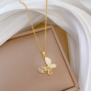 Detail of luxury butterfly necklace with crystals and shells on a jewelry box
