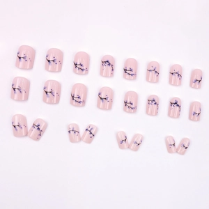 Elegant floral press-on nail kit with light pink base and blue bud pattern designs