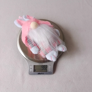 Detailed view of pink plaid Easter bunny gnome plush toy on a digital scale weighing 98.2g