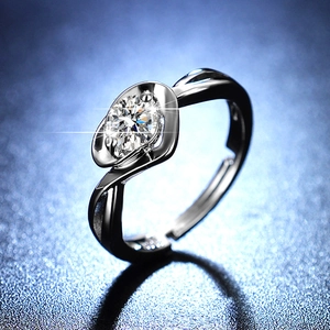 Macro shot of S925 sterling silver bypass ring with sparkling moissanite round cut stone