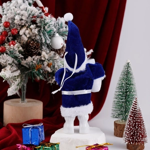 Rear view of a blue plush Santa figurine standing on a snowy base amidst gift boxes
