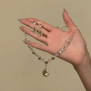 Vintage court style floral jewelry set with champagne crystals and teardrop pendants