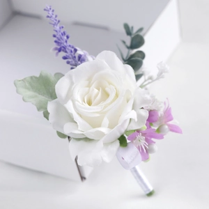Artificial white rose boutonniere with lavender accents and eucalyptus for wedding groom