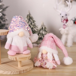 Pink Christmas gnomes with sequined knit hats and plush beards for holiday decor