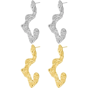 Macro shot of gold and silver irregular pleated 304 stainless steel earrings with fluid metal texture