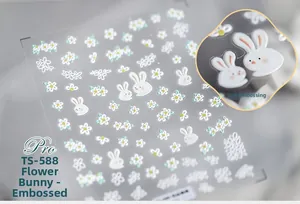 Detailed macro view of TS-588 5D embossed nail stickers with white rabbits and daisies