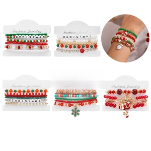 Close-up of Christmas beaded bracelet set with Santa pendants and holiday motifs