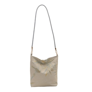 Jacquard canvas shoulder bag with blue bird and bamboo patterns on white background
