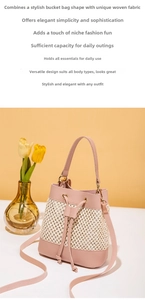 Detail of hollow woven bucket bag with pink leather trim and drawstring closure