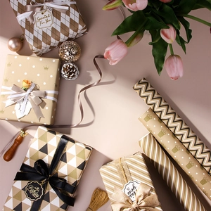 Elegant gold-printed gift wrapping paper with geometric patterns and striped designs