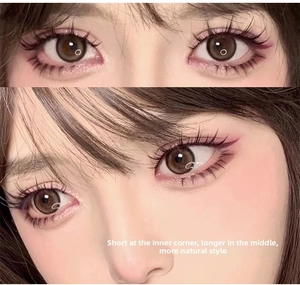 Detailed close-up of natural false eyelashes with shorter ends and longer center fibers