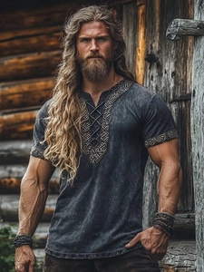 Detail of Viking style men's T-shirt featuring lace-up V-neck and ethnic woven texture